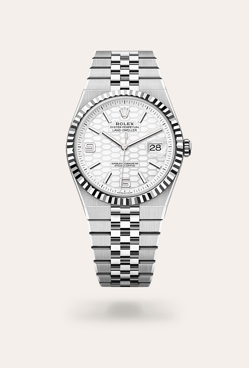 Rolex Land-Dweller 40 in Oyster, 40 mm, Oystersteel and white gold with a Intense white, honeycomb motif dial, Fluted bezel, and Flat Jubilee, five-piece solid links bracelet