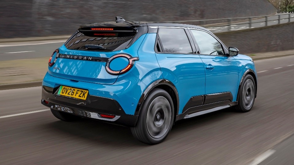 Nissan Micra EV driving rear view