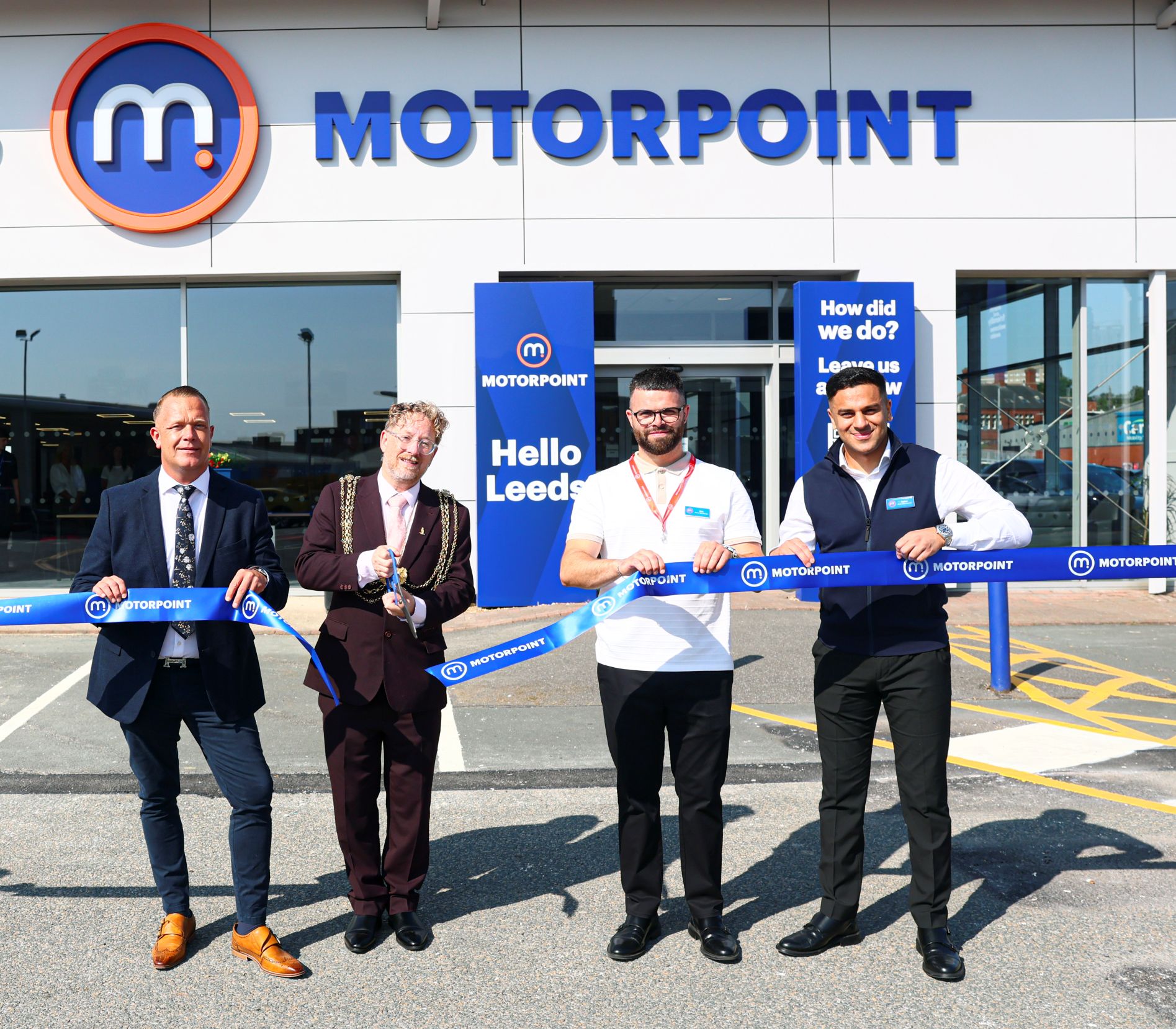 (L-R) Chris Goodison – Regional Operations Director at Motorpoint, Councillor Stephen Holroyd - Lord Mayor of Leeds, Dan Stevens - General Sales Manager Motorpoint Leeds and Raees Nomaz – Assistant Sales Manager, Motorpoint Leeds all cutting the ribbon to open the store.