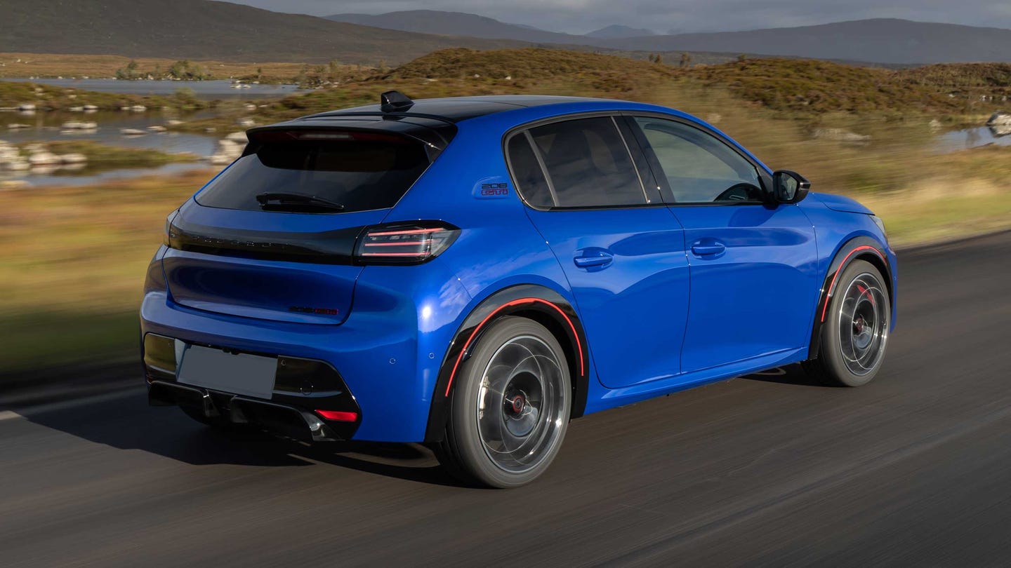 Peugeot E-208 GTi driving rear view
