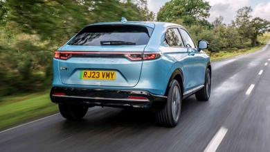 Honda e:Ny1 driving rear view