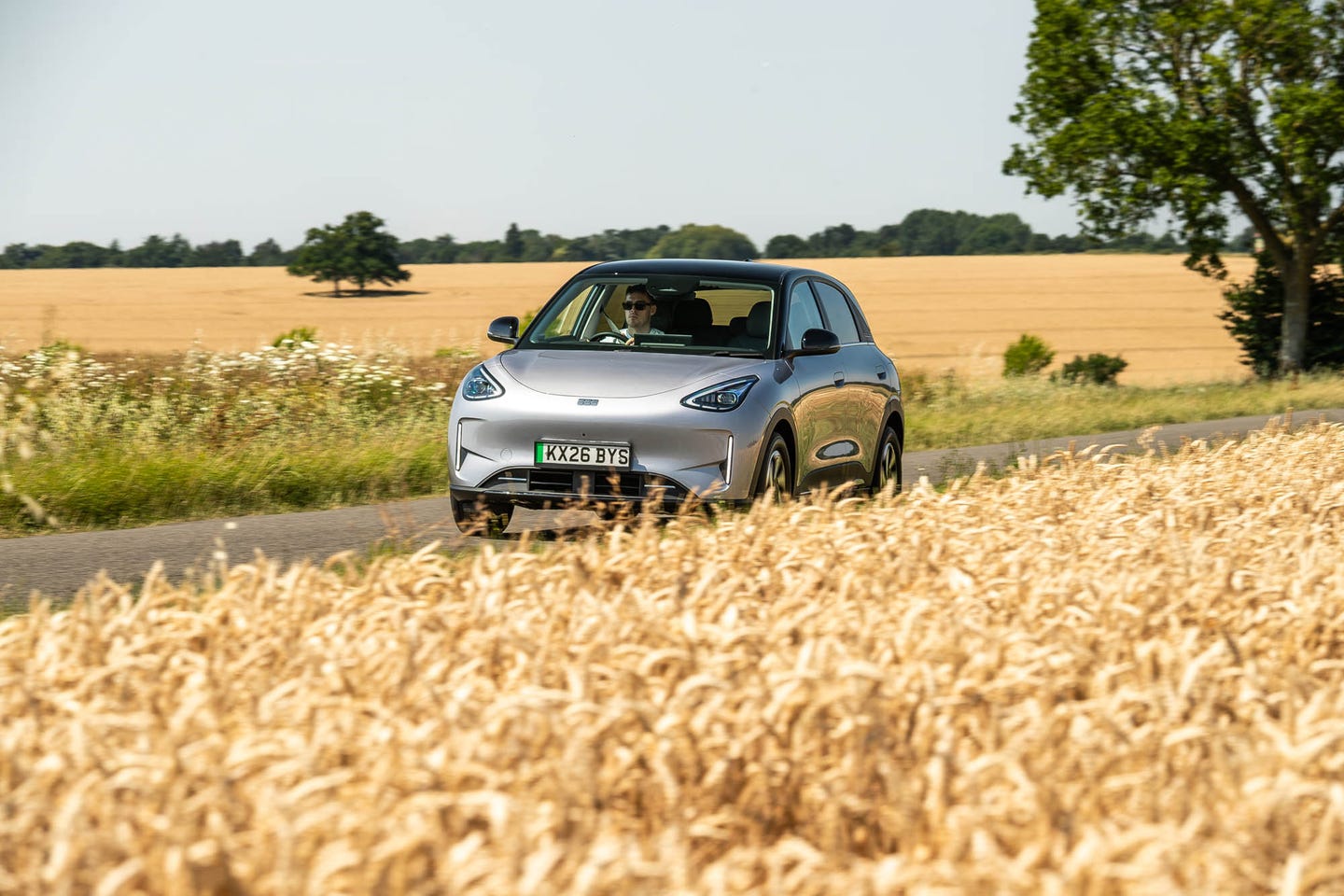 Geely EX2  driving front cornfield