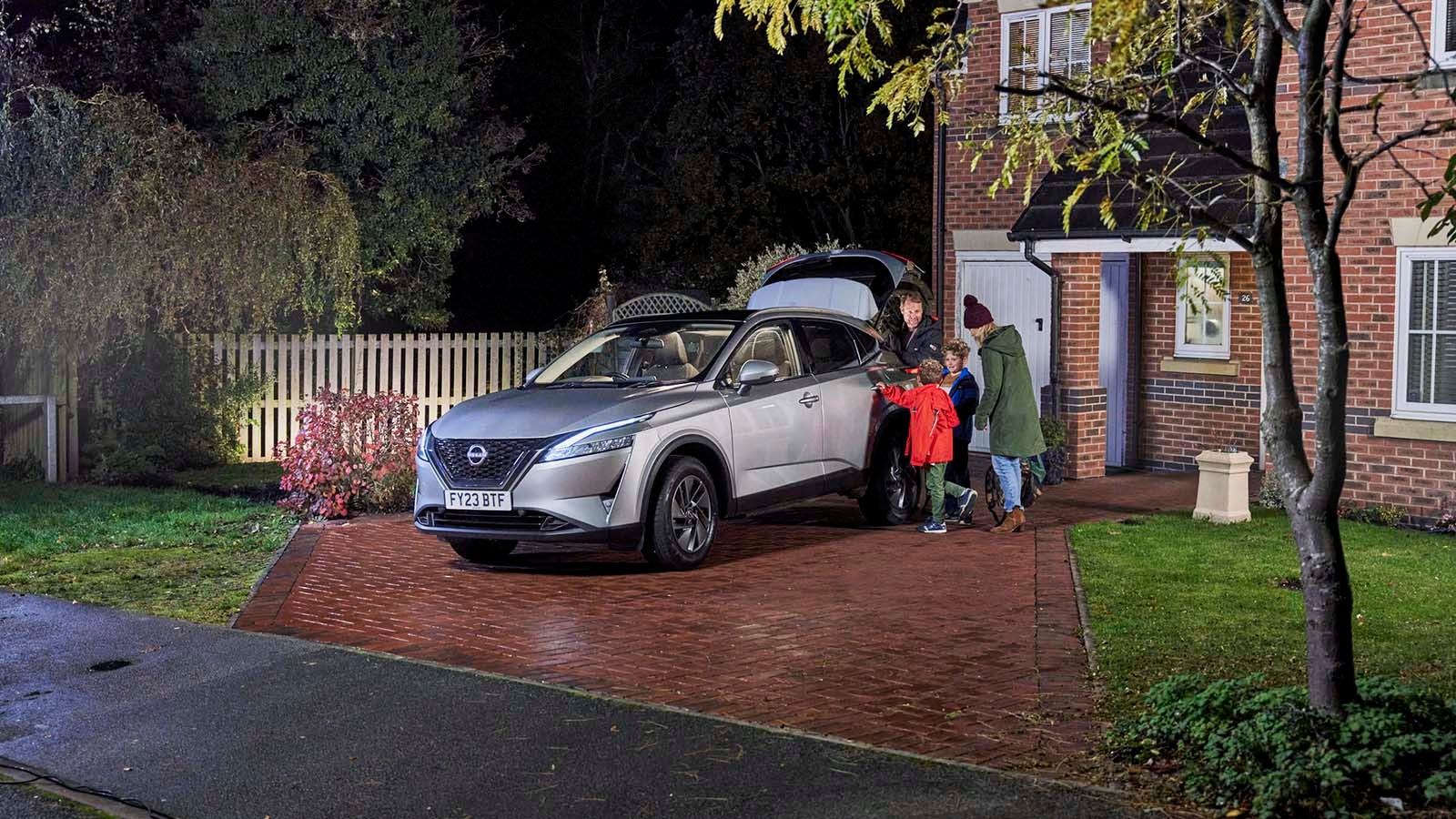 Family getting into silver Nissan Qashqai