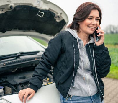 woman calling breakdown assistance