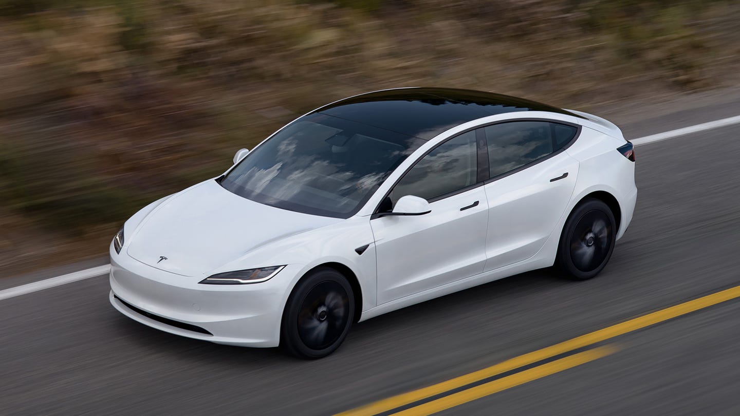 Tesla Model 3 front three quarter driving