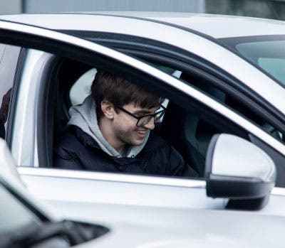 man test driving car