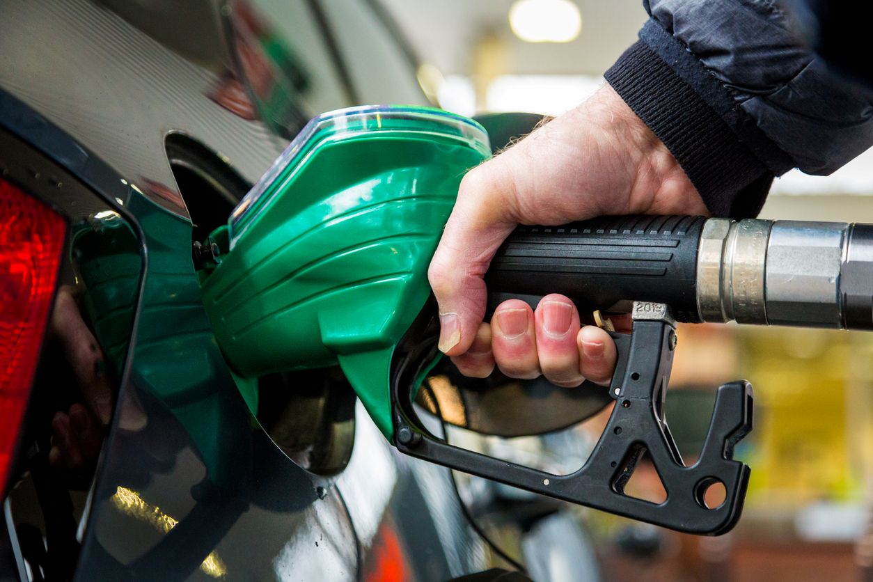 Close-up of a person filling up their car with fuel at a petrol station