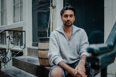 A man sits on a step