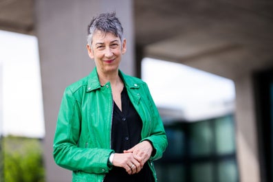 A woman in a green jacket
