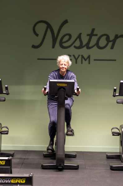 Older woman riding a fitnessbike indoor