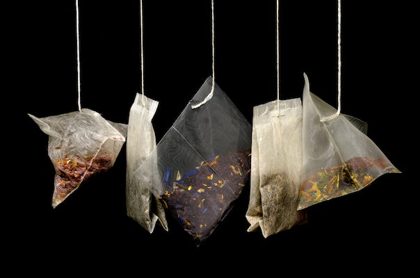 Tea bags on a black background