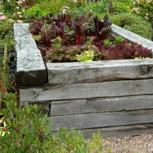 Beds built from sleepers are sturdy and attractive