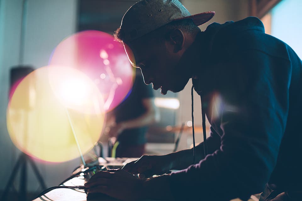 man with cap on the computer