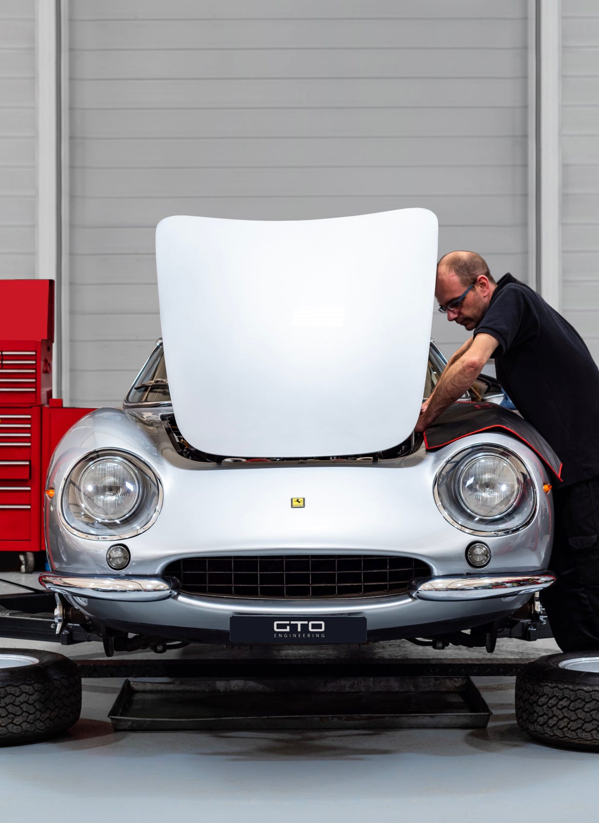 GTO mechanic working on a classic Ferrari
