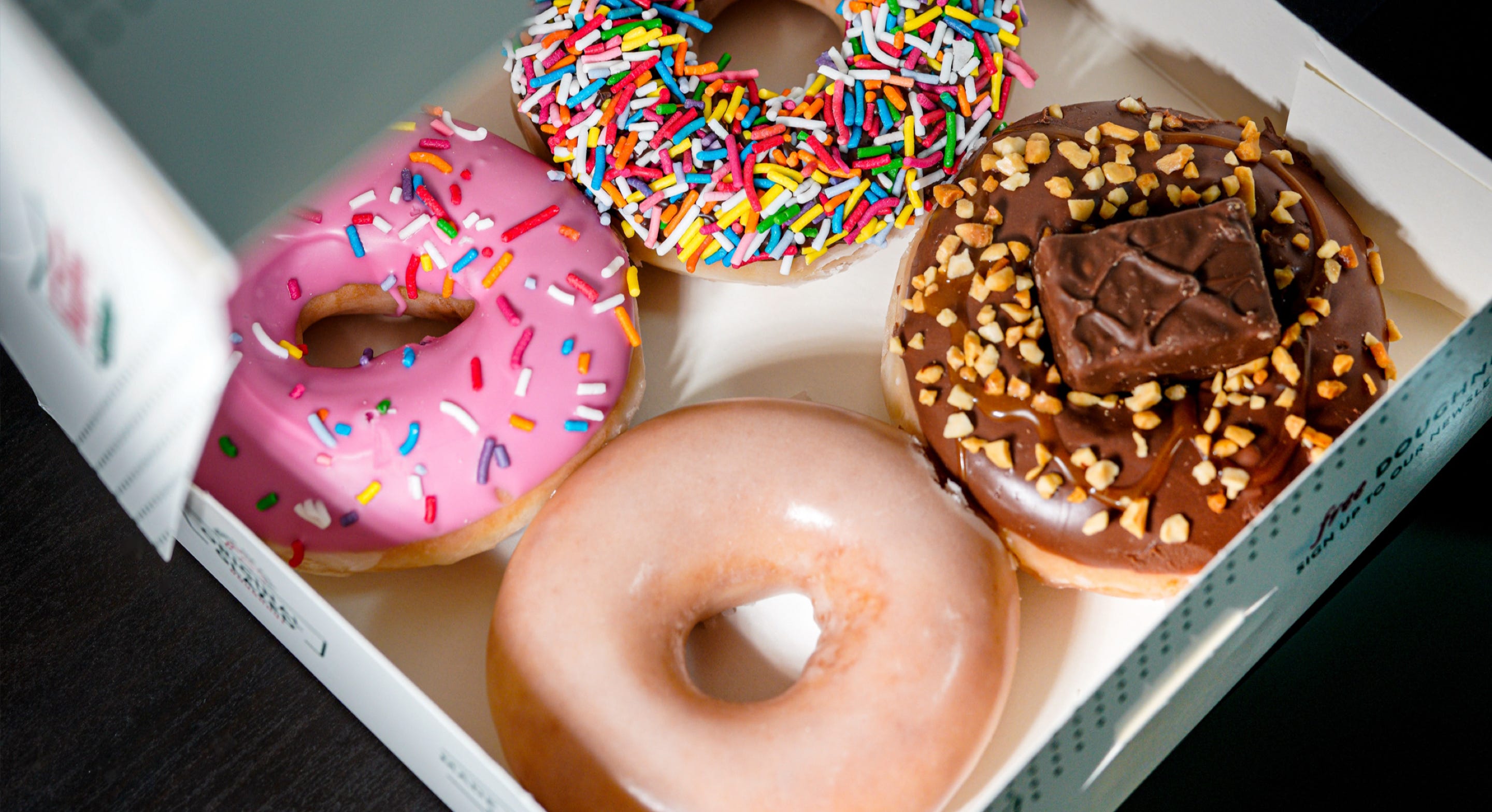 Krispy Kreme box with doughnuts inside