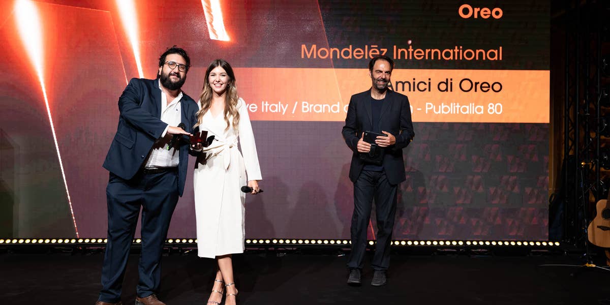 A group of the Carat Italy team standing on a stage at the Effie Awards