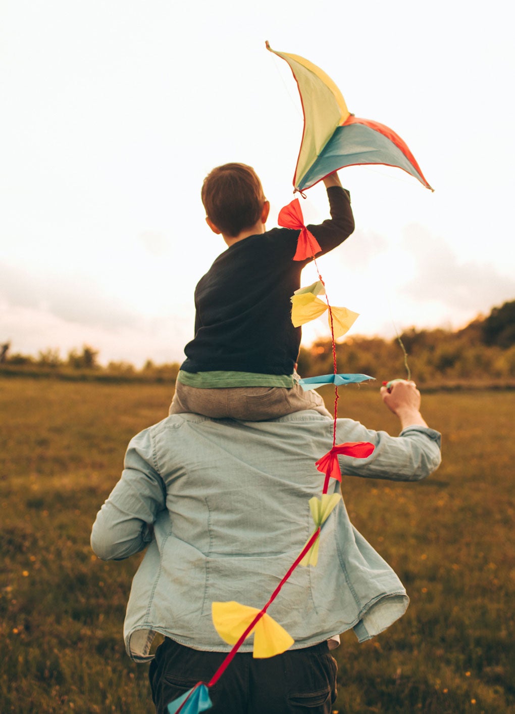 Father and son playing with kite