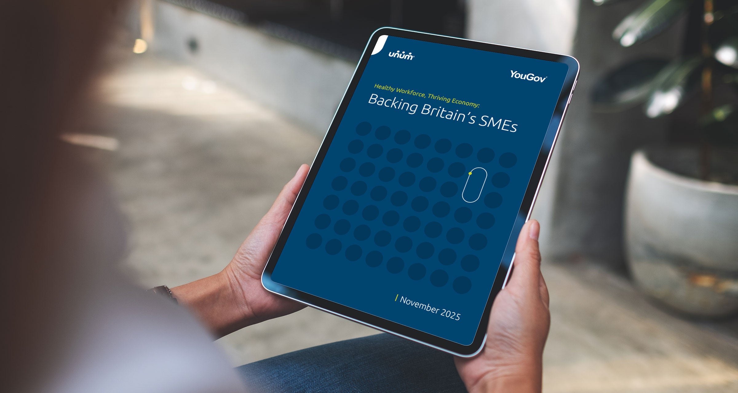 A person holding a tablet