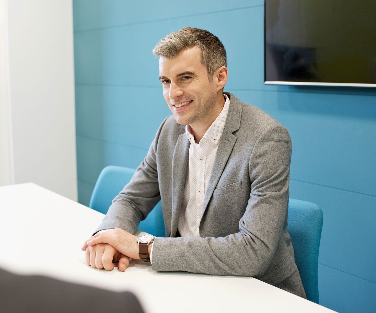 Man in grey suit in the office