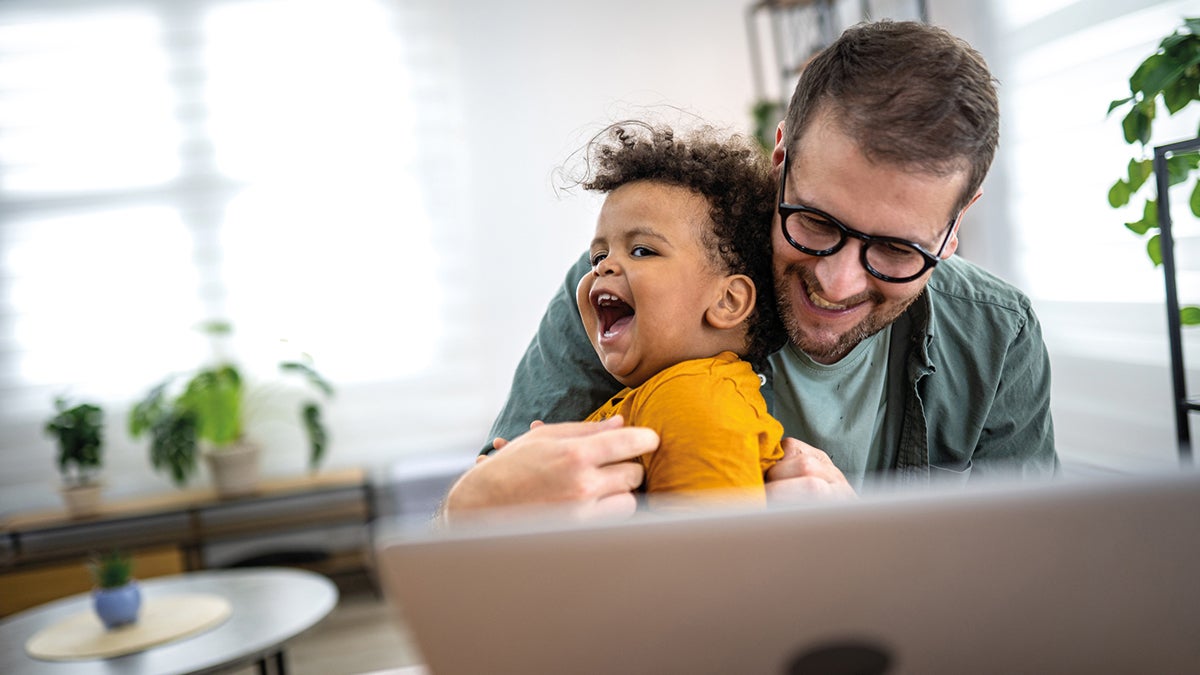 A man holding a toddler