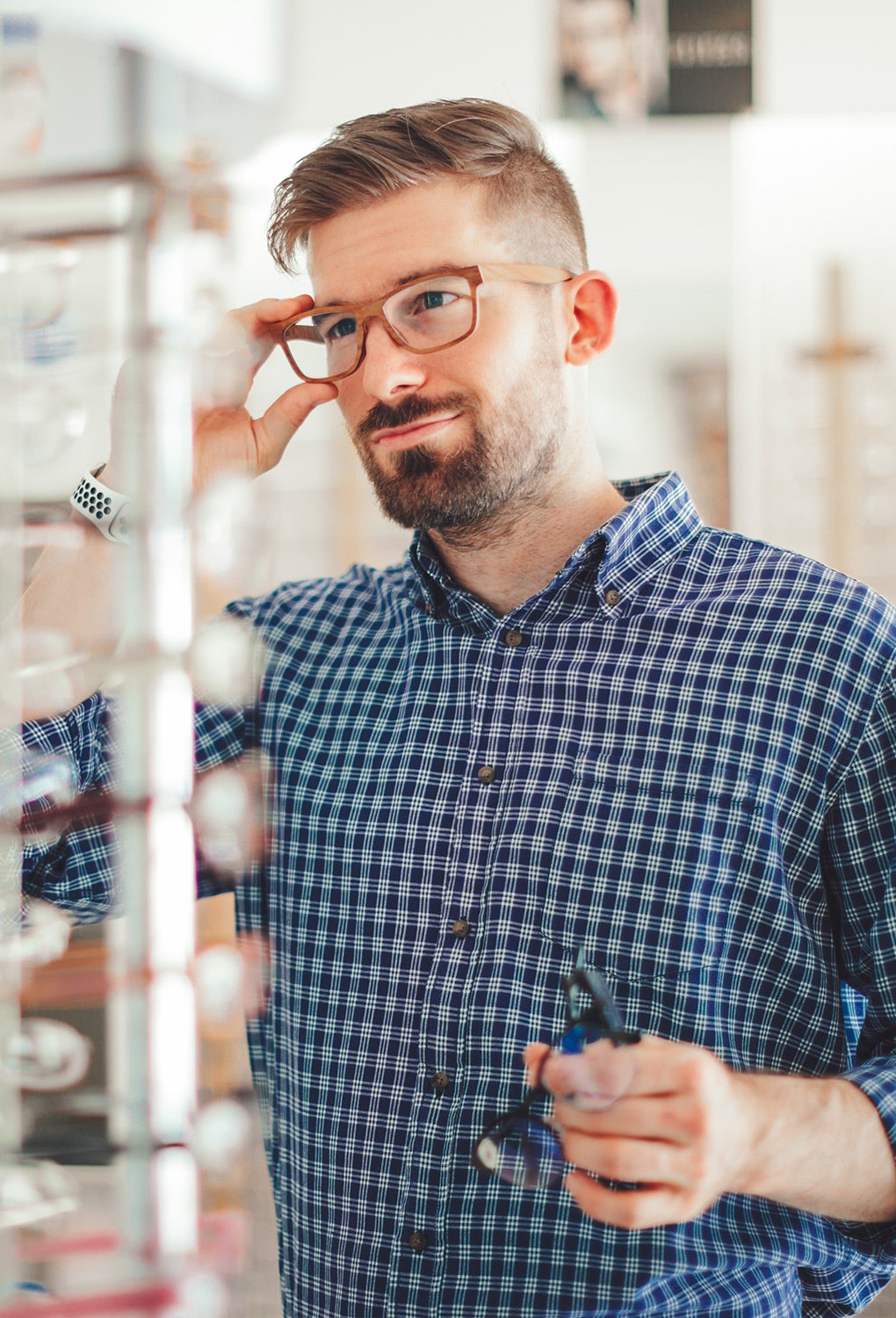 Optical cover from Unum man trying on glasses