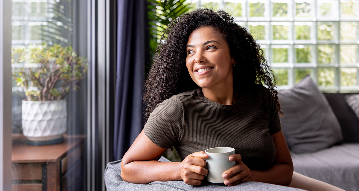 A woman holding a cup