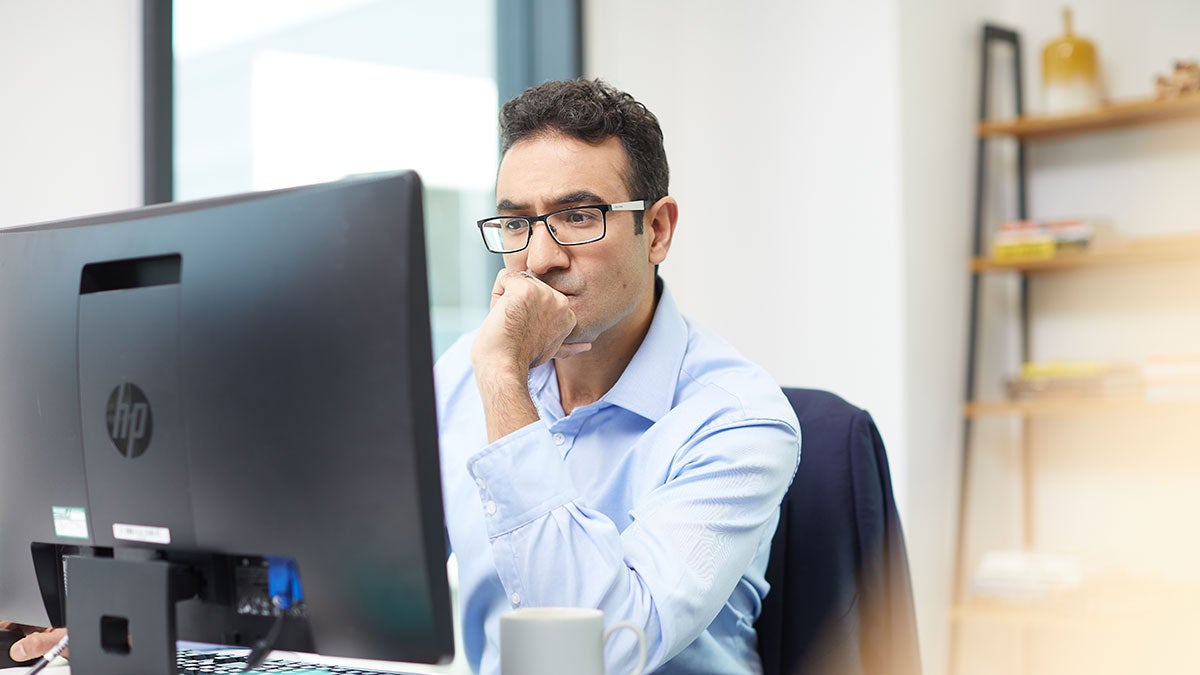 Man reading from his computer screen
