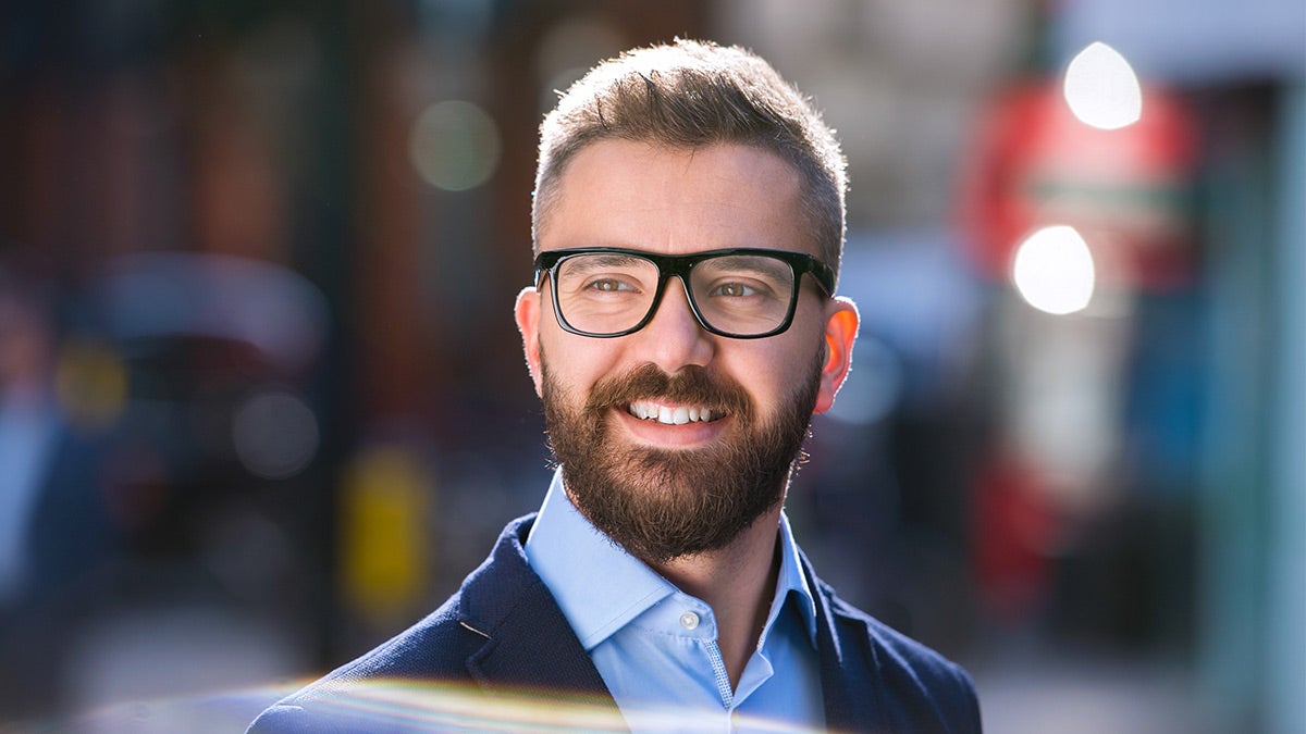 Optical cover from Unum man wearing glasses