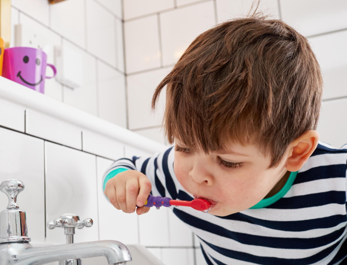 Boy brushing teeth