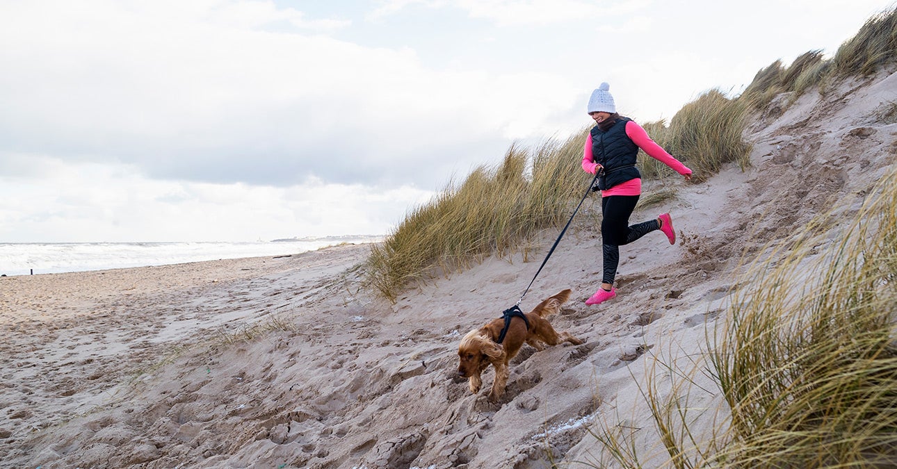 Winter wellbeing running on the beach