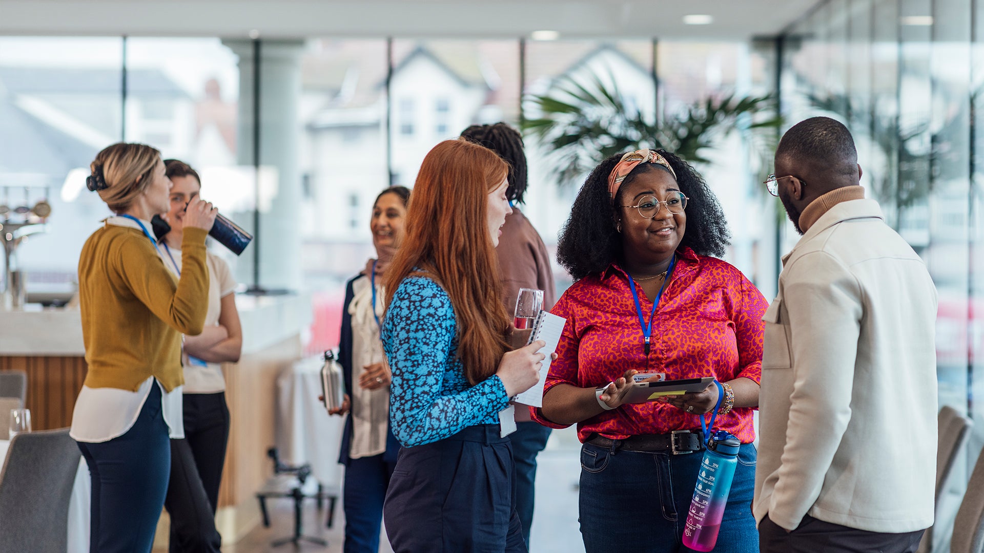 Working for communities, employees at an event having a conversation