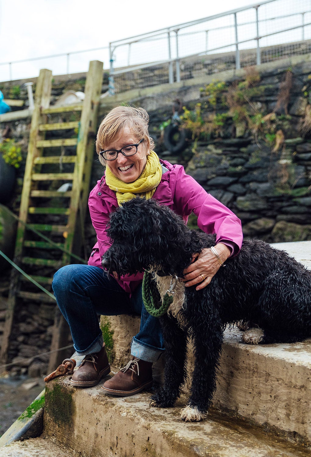 Lady stroking a dog