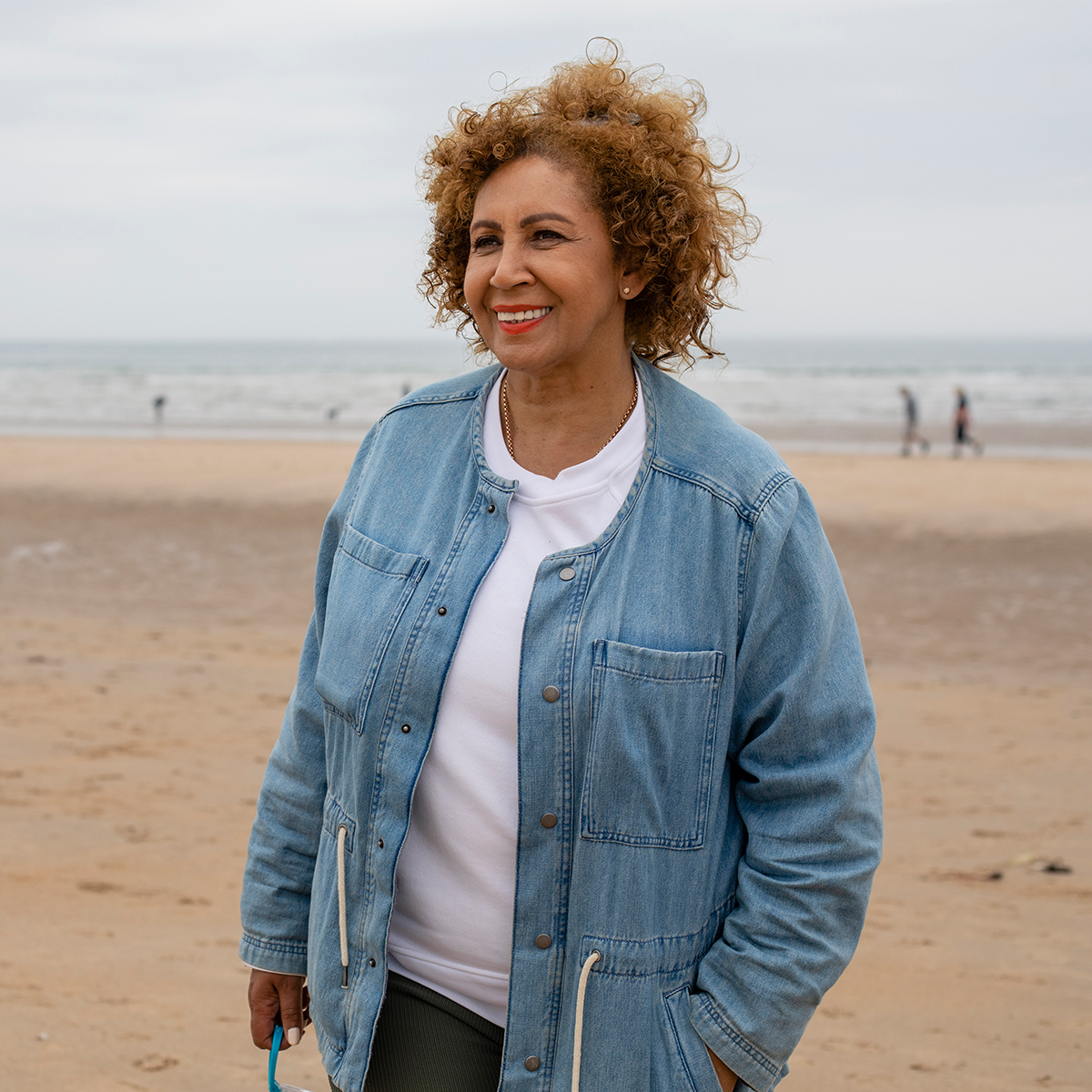 A woman standing on a beach