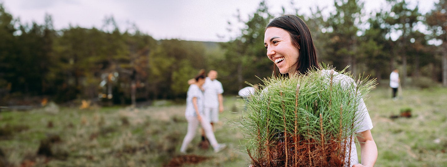 Employee volunteering outdoors