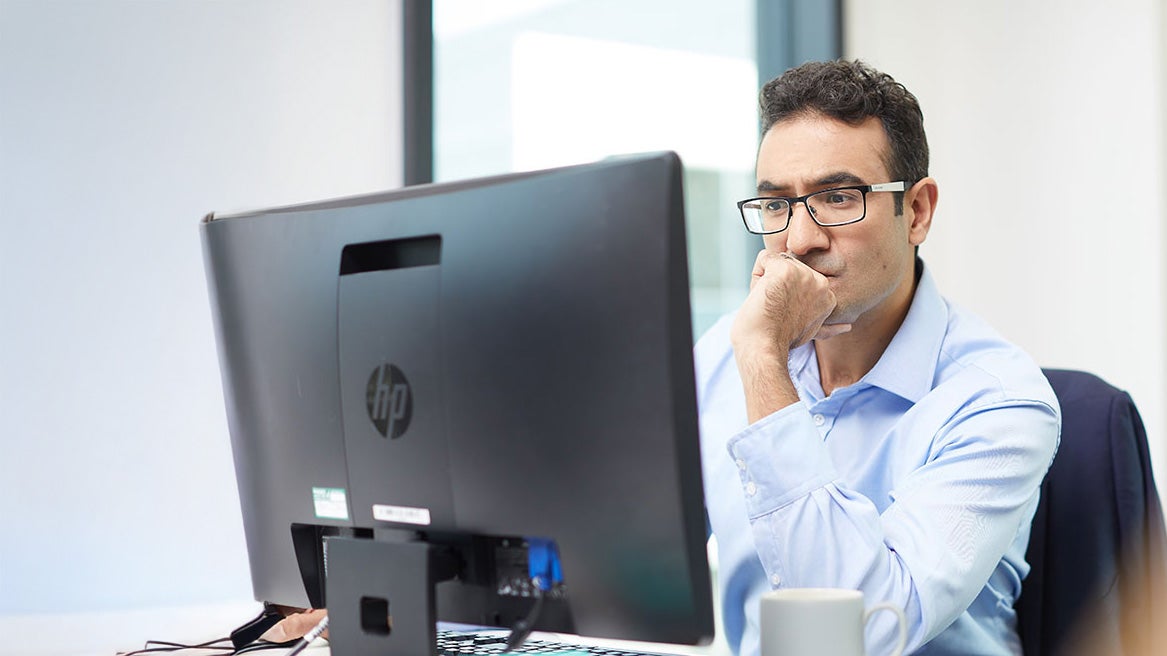 Man reading from his computer screen