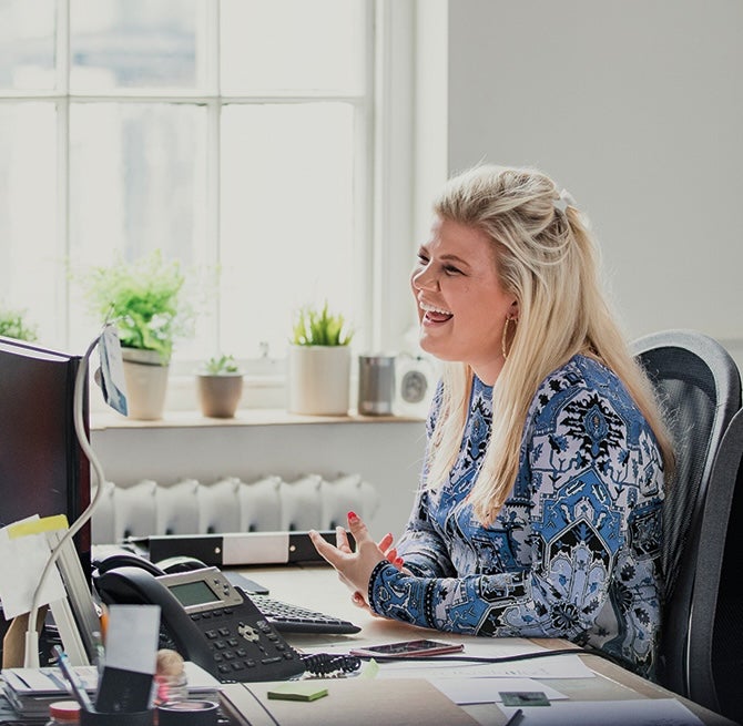 A woman sitting at a desk