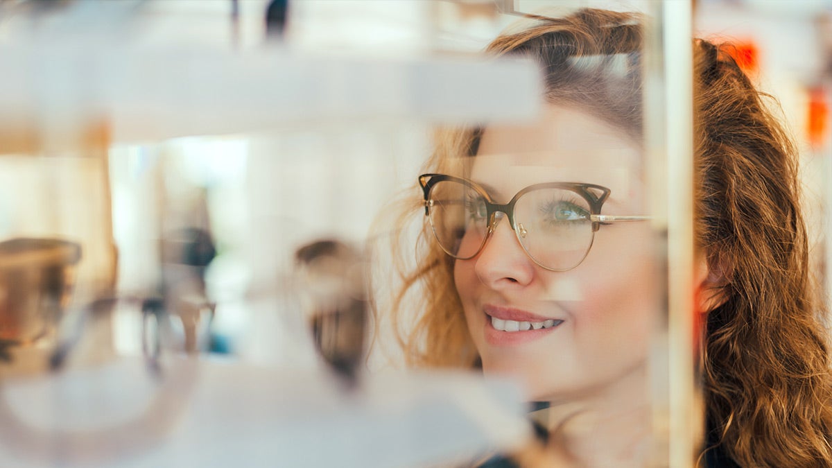 Optical cover from unum woman wearing glasses