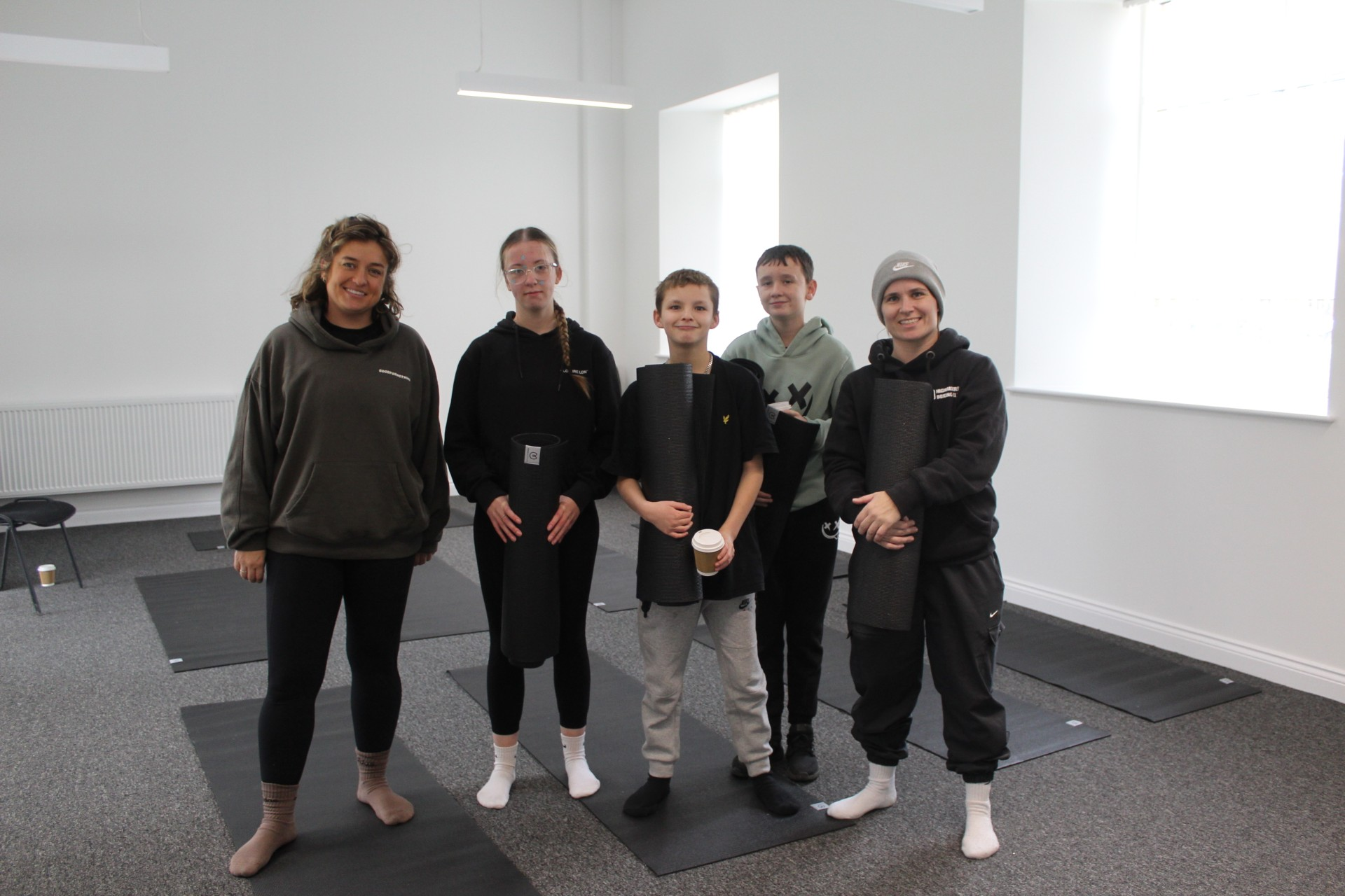 Yoga instructors and children pose for a photo at Bristol Wellbeing and Social Action Festival