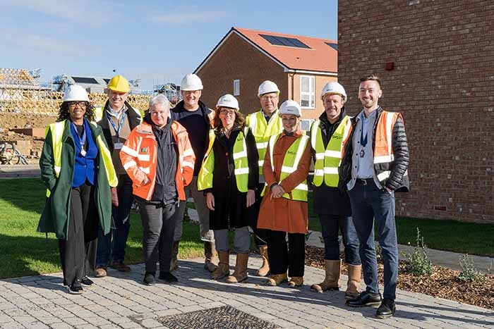 Representatives from SNG, Isle of Wight Council, Royal Town Planning Institute and Captiva Homes pose for photo at Three Oaks development.
