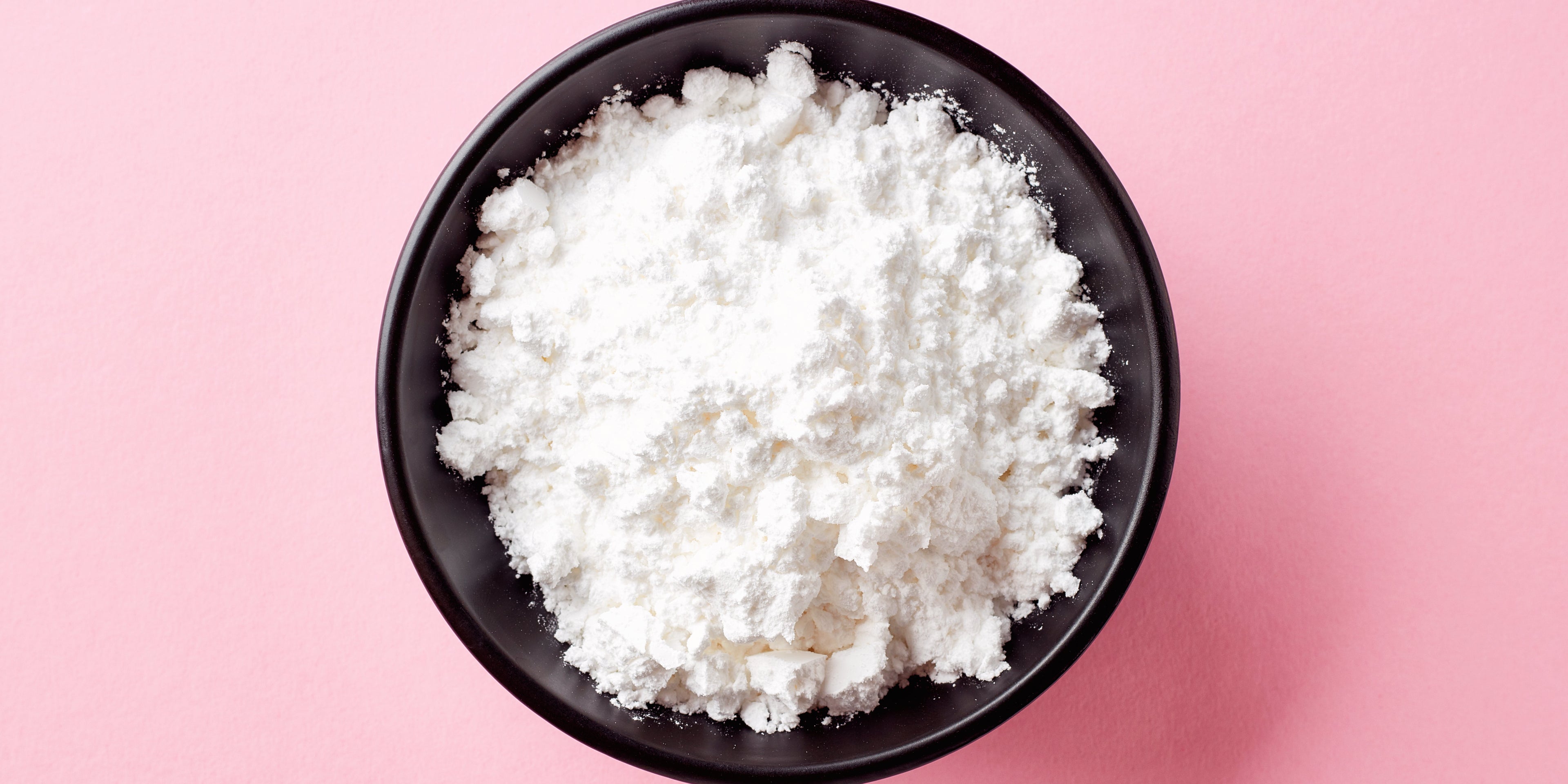 black bowl filled with icing sugar