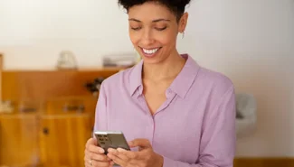 Image of a woman holding a mobile phone.