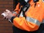 Traffic warden writing out a ticket