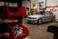 An E36 BMW 3 Series parked in a garage