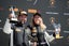 Racing drivers Jason Gagne-Keats and Charlie Martin on the podium, holding trophies