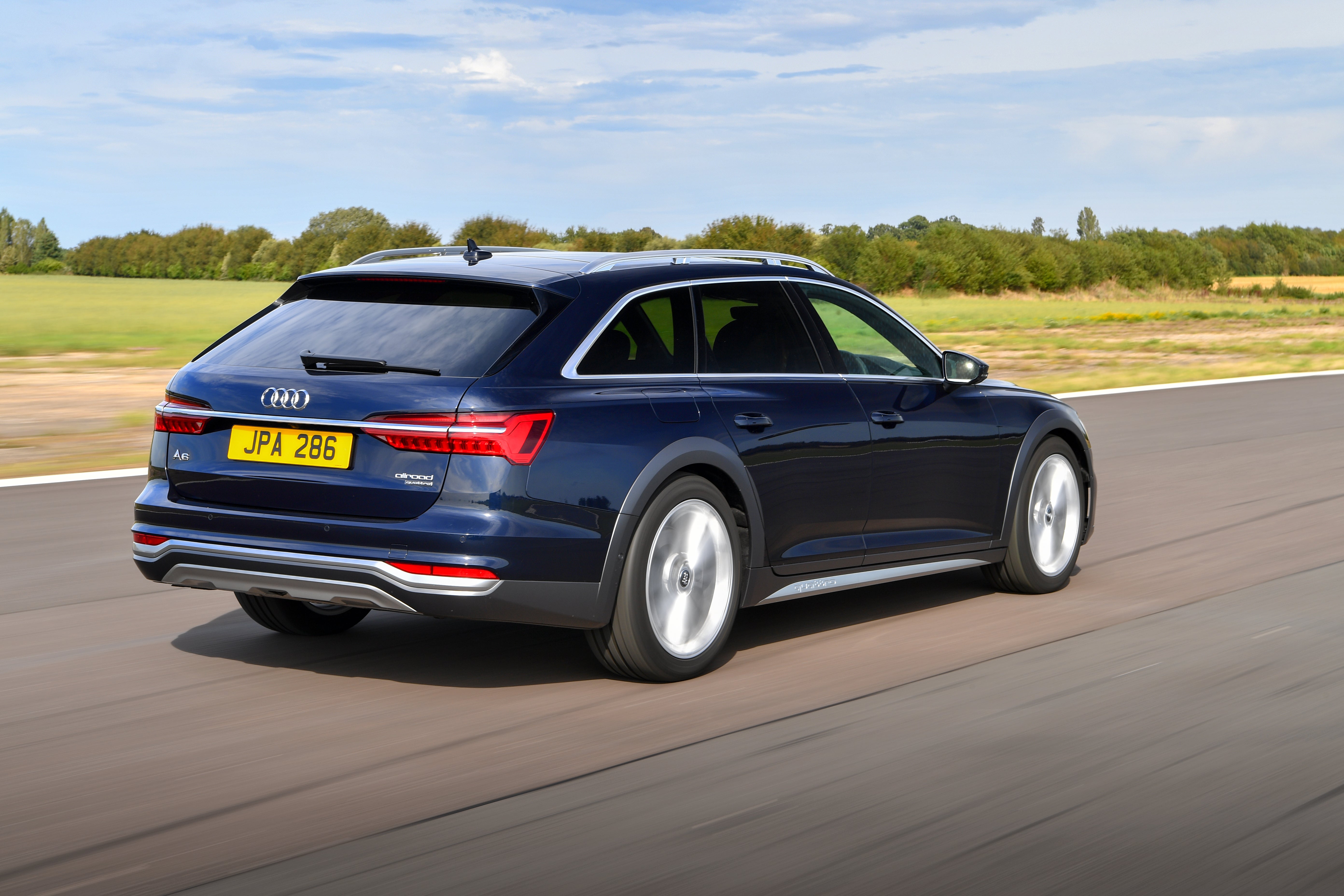 Audi A6 Allroad Review 2023: exterior rear three quarter photo of the Audi A6 Allroad on the road
