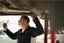 Technician working on a catalytic converter