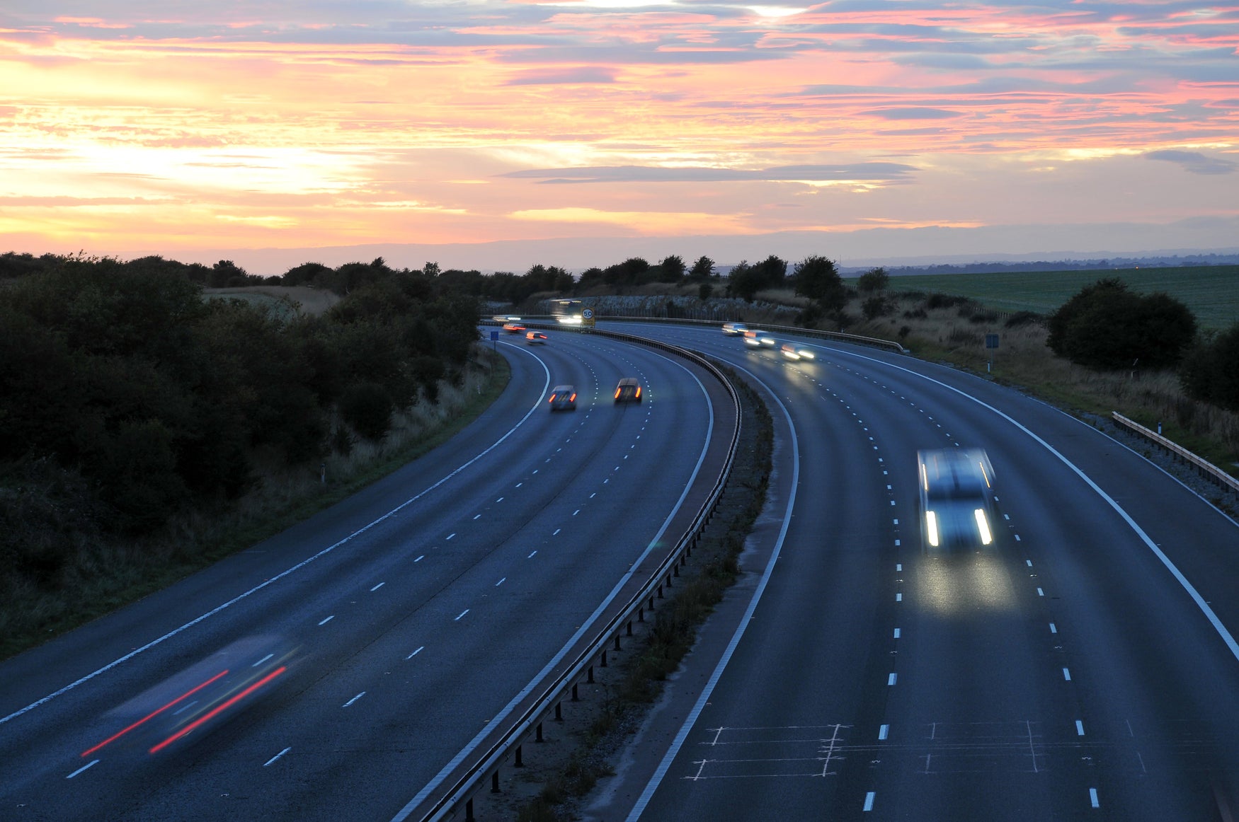 Curving motorway sunset