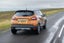 Renault Captur (2013-2019) Review: exterior rear three quarter photo of the Renault Captur on the road