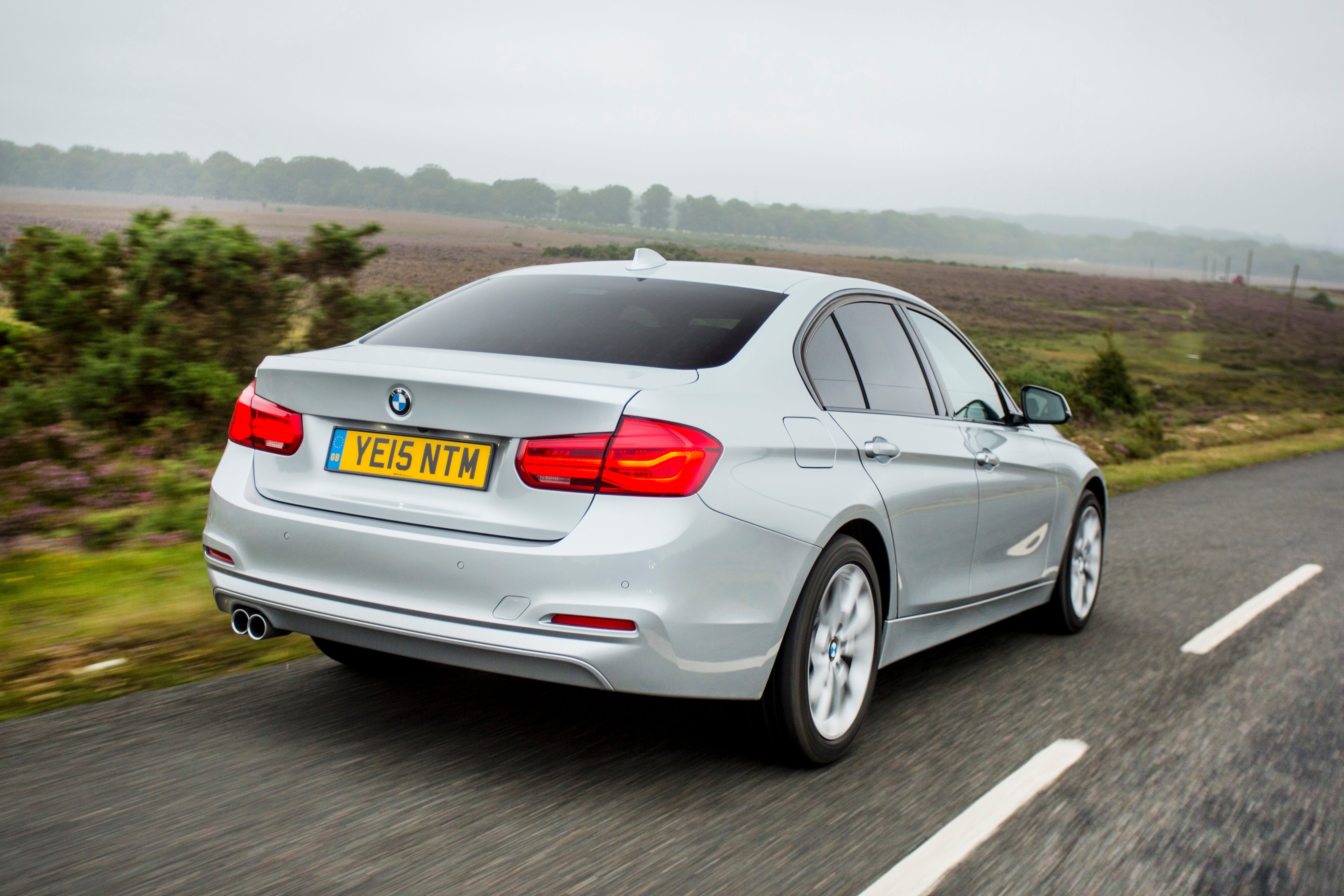 BMW 3 Series (2012-2018) Review: Exterior rear three quarter photo of the BMW 3 Series on the road