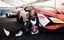 Racing driver Charlie Martin sat by the side of her Lamborghini Huracan Super Trofeo Evo2.